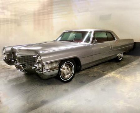 Silver 1965 Cadillac Coupe DeVille owned by TV character Don Draper sold at auction.