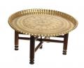 Brass table with wood legs belonging to character Megan sold at Mad Men auction.